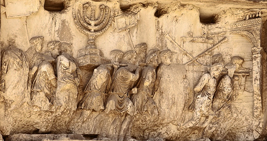 Triumphant Romans carry the menorah, trumpets and table of showbread plundered from the Temple of Jerusalem (Arch of Titus, Rome)