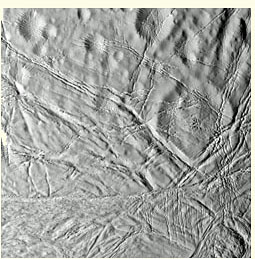 The surface of Saturns moon Enceladus - clearly not as originally created. Impressions of ancient craters are visible upper half of the picture, criss-crossed by what are interpreted to be faults. Image taken by the Cassini spacecraft, contrast enhanced.